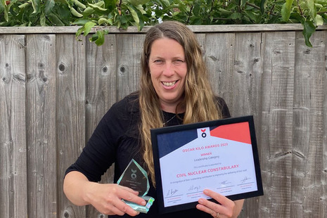 Emma Aldred, CNCs Head of Occupational Health and Wellbeing, with the award