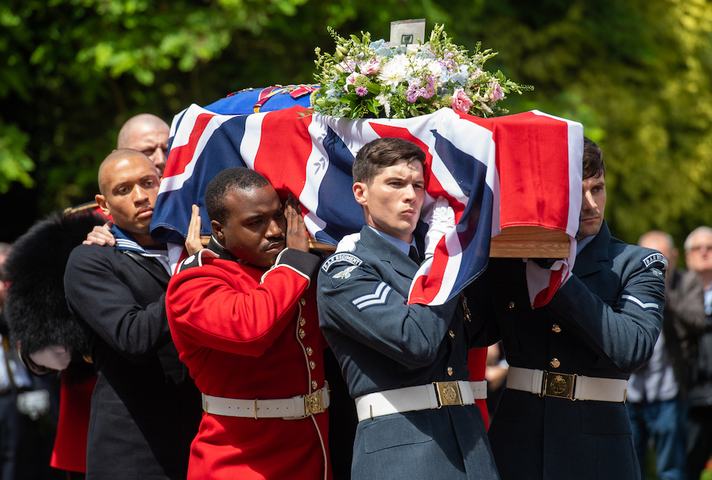 Military personnel from all three services carry the coffin of Dame Vera Lynn into her funeral service