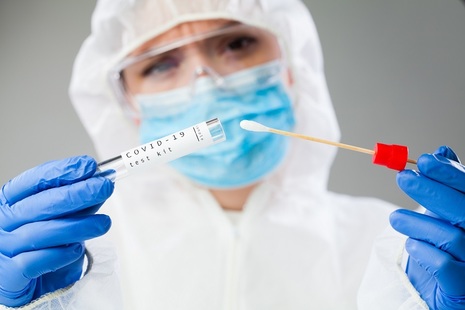 Medical Professional Holding COVID-19 Sample