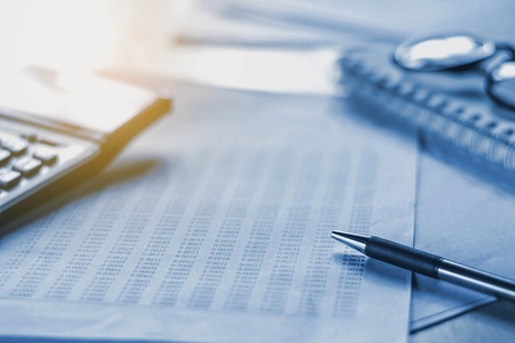 Calculator & Pen on Desk