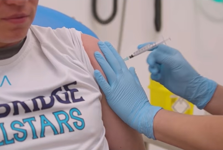 A nurse injecting a participant in the vaccine trial (credit: University of Oxford).