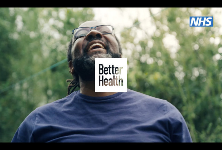 Smiling man and Better Health logo