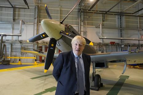 Prime Minister Boris Johnson stands alongside a Spitfire at RAF Lossiemouth, Moray, as part of his tour of Orkney and the Highlands.