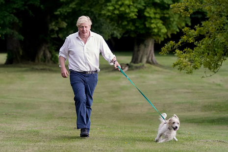 Prime Minister Boris Johnson takes his dog Dilyn for a walk in the grounds of Chequers as he encourages people to exercise for a better health.