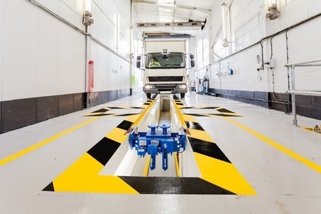Photo of a lorry driving over an inspection pit