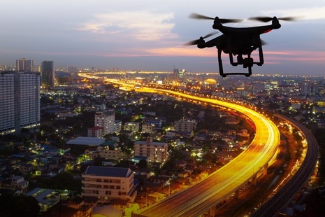 Drone flies over a city