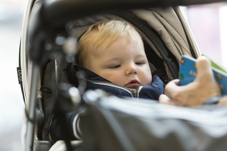 Close up of a baby in a buggy