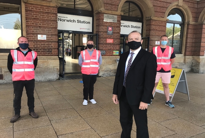 Chris Heaton-Harris with Journey Makers outside Norwich station.