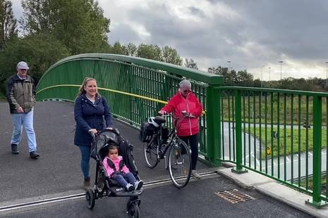 local residents cross the new bridge