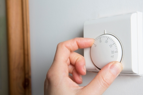 Hand adjusting thermostat.