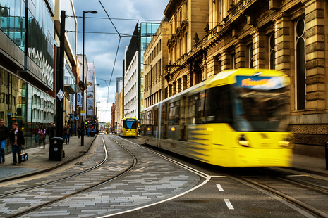 Tram travelling down a street