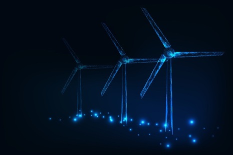Image depicts a wind farm at night.