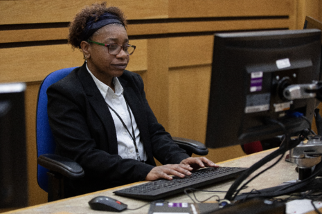 Court clerk working on computer