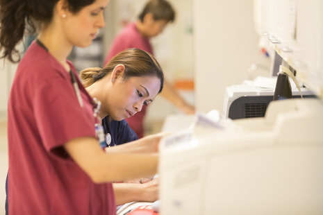Close-up of some nurses doing admin.