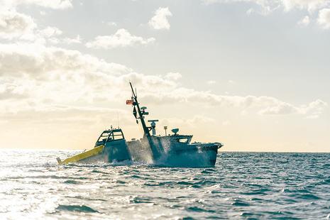 Image depicts an Autonomous Minehunting System in the water.