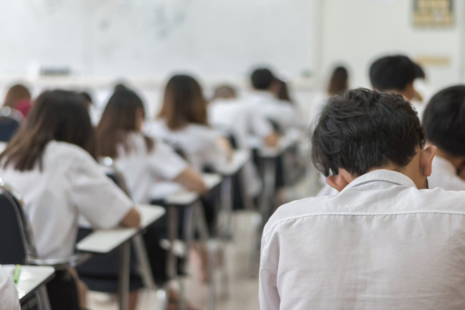 An exam hall with students taking an exam