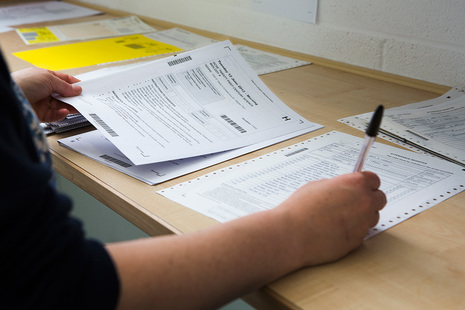 Person marking exam papers