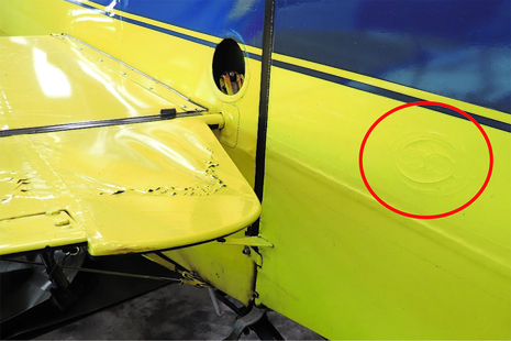 Elevator and rudder damage (circled)