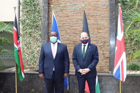 Defence Secretary Defence Ben Wallace stands alongside Dr Fred Matiang’i, Kenyan Cabinet Secretary for the Interior, in front of Kenyan and British flags