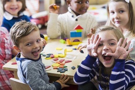 young children with smiley faces
