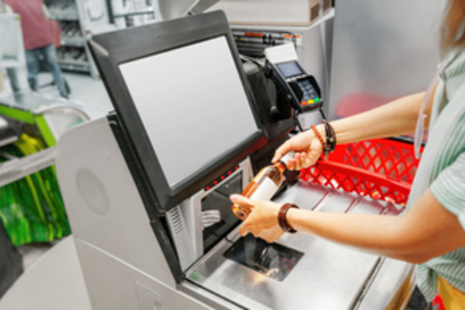 Female scanning an item at a checkout