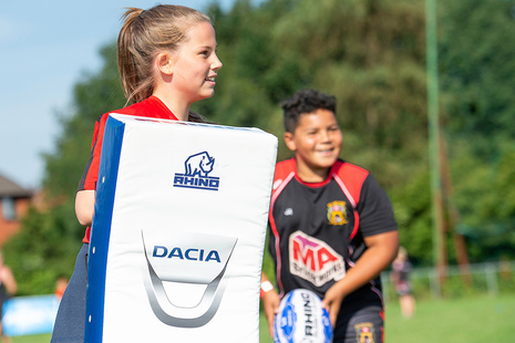 Young people playing rugby league