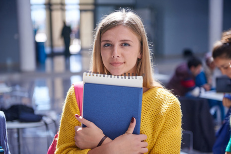 female student holding a file