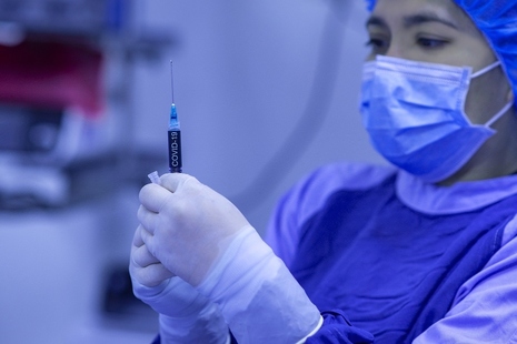 woman in with vaccine