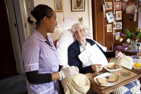 Carer with an older lady in a care home