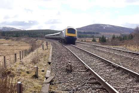 The derailed power car at the rear of the train