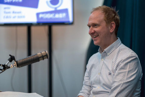 GDS Chief Executive Officer Tom Read sat in front of a microphone.