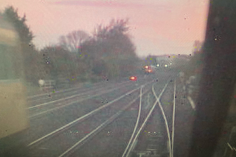 CCTV image from the rear of the train of empty coaches, showing the rail grinding train, travelling towards the junction, on the left (courtesy of East Midlands Trains)
