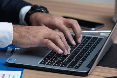 Person working at a laptop computer