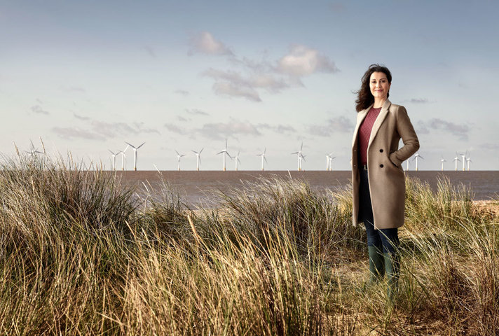 UKEF employee standing on a windfarm
