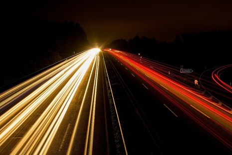 Light-trails from cars on motorway captured using time-lapse photography
