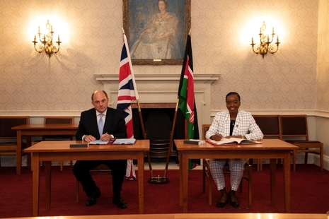 Ben Wallace and Dr Monica Juma sign the agreement in London