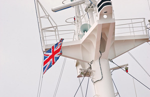 Ship mast flying Union Jack flag