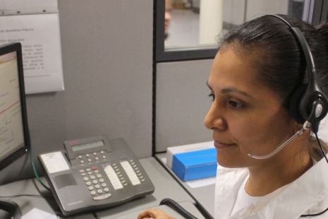 Person wearing a telephone headset answering a call