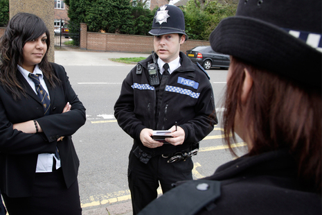 Police officers talking to a child