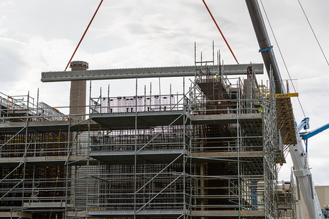 Roof beams being put in place on waste store extension