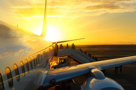 Passengers boarding an airplane,