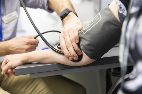 Close up of doctor using stethoscope
