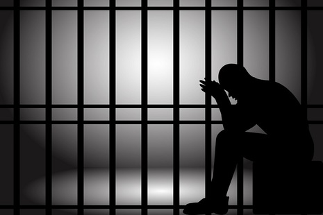 Silhouette of adult in detention