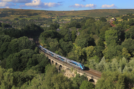 Passenger train crossing the Saddleworth Viaduct.