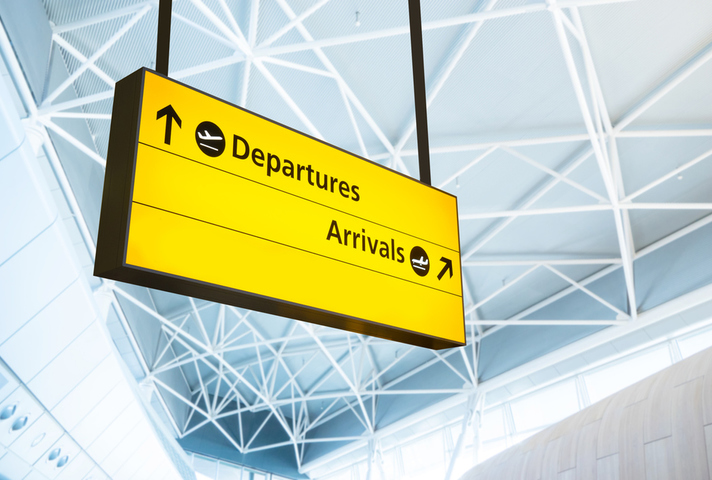 Arrivals and departures sign at an airport