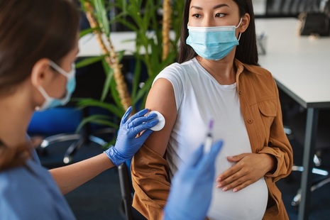 Pregnant woman getting vaccinated