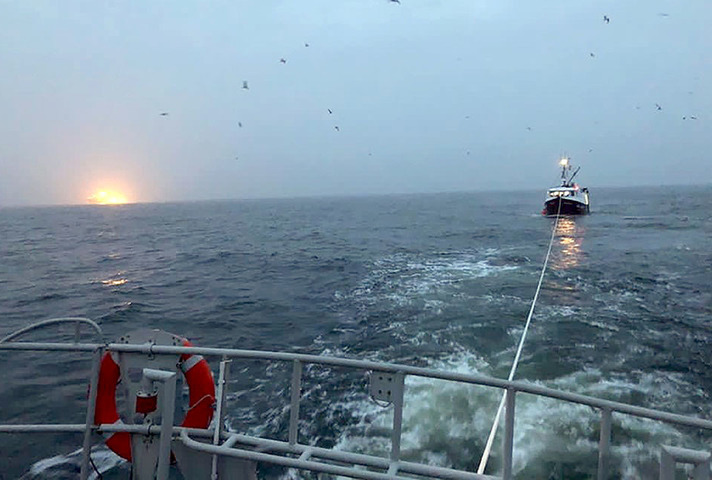 The fishing vessel Achieve being towed back to port