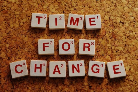 Game pieces spelling out words 'time for a change'