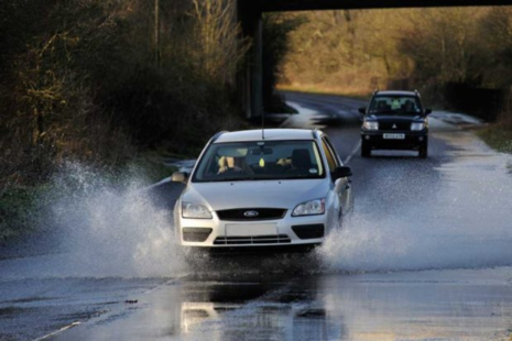 Car travelling through flood water