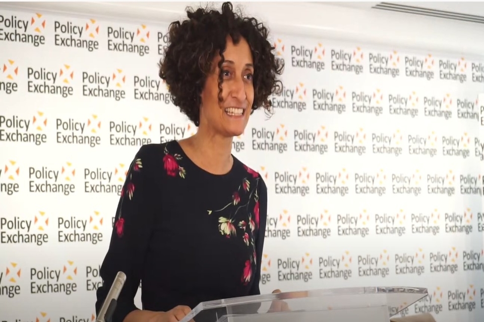 Katharine Birbalsingh delivers speech in front of Policy Exchange banner